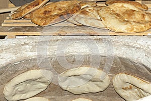 Baking pita bread in a stone oven