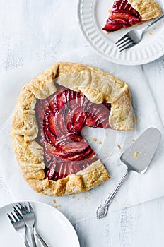 Baking plum galette, a rustic french dessert pie