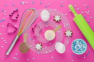 Baking protein, eggs and kitchen tools with cookie cutter on pink background