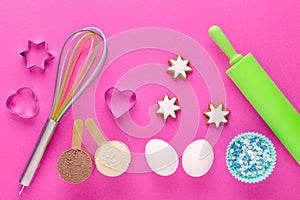 Baking protein, eggs and kitchen tools with cookie cutter on pink background