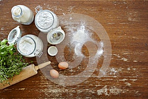 Baking scene flour and eggs on wooden table