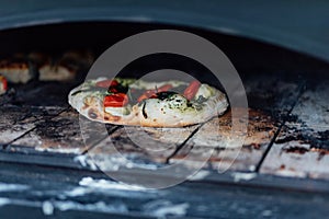 Baking and serving pitta brad, pizza and fresh bread