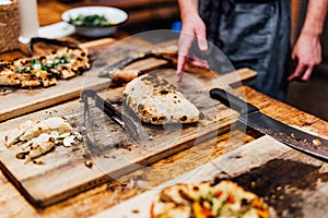 Baking and serving pitta brad, pizza and fresh bread