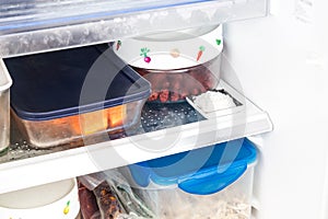 Baking soda placed in refrigerator to deodorize bad odor.
