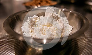 Baking soda powder in small stainless steel plate.