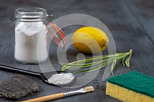 Baking soda, vinegar and cut lemons Materiel for non toic cleaning