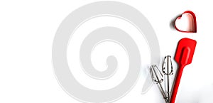 Baking supplies on white banner. Spatula, mixer whisks, cookie cutter on white background
