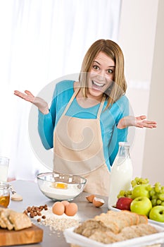 Baking - Surprised woman with ingredients