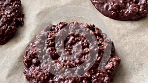 Baking sweet chocolate oat bisquits in the oven, homemade food recipe, slow motion