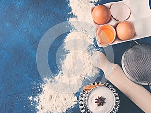 Baking tools rolling pin whisk and ingredients flour egg