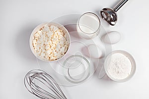 Baking utensils and cooking ingredients for a tarts, cookies, dough and pastry. Flat lay with eggs, flour, sugar