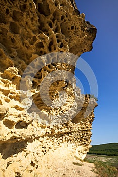 Bakla is ancient cave town in Crimea. Scenic sunny day view of Bakla under blue sky