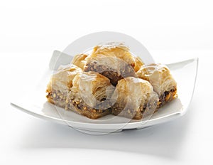 Baklava pieces on a white plate