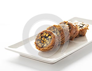 Baklava with pistachio on a white plate