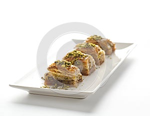 Baklava - turkish dessert on white plate