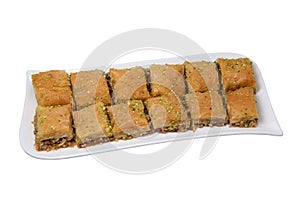 Baklawa on a plate on a table, top view, baklava, feast treat ramadan traditional dessert