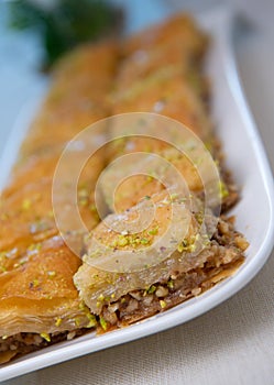 Baklawa on a plate on a table, top view, baklava, feast treat ramadan traditional dessert