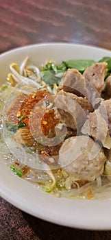 Bakso, indonesian meatball style served with beef broth soup and noodle springkled with fried onion and spring onion coupled with