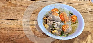 Bakso, indonesian meatball style served with beef broth soup and noodle springkled with fried onion and spring onion coupled with