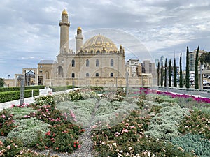 Baku, Azerbaijan, September, 10, 2019. Flower bed in front of the mosque Tezepir in the fall in Baku