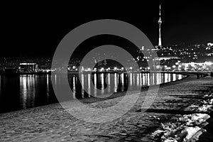 Baku Bulvar with snow at night, looking towards the Telecoms Tower, in the capital of Azerbaijan