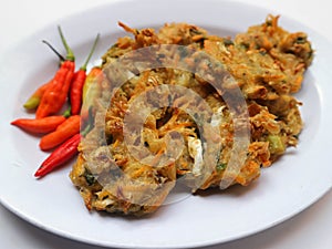 Bala-bala or Bakwan or vegetable fritter, traditional Indonesian snack, made from carrot, cabbage and bean sprouts and mix with