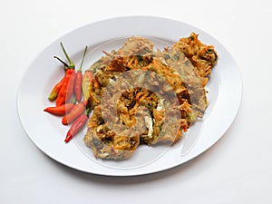Bala-bala or Bakwan or vegetable fritter, traditional Indonesian snack, made from carrot, cabbage and bean sprouts and mix with