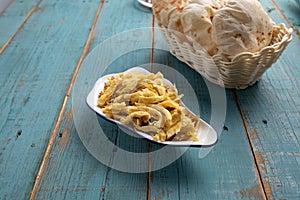 balalet with bread served in dish isolated on wooden table side view of arabian food