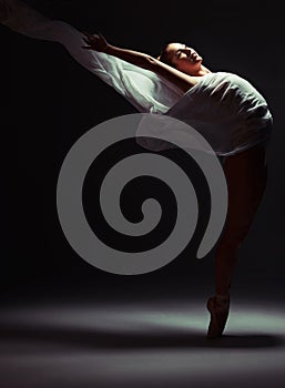 Balance, ballerina and woman in studio for art performance, rehearsal or ballet routine. Theatre, spotlight and female