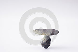 Balance different stone concepts together on white background