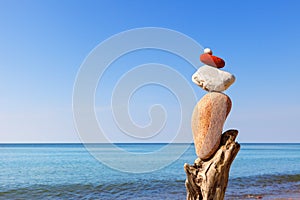 Balance pebbles on the background of the sea