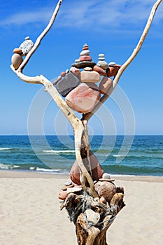 Balance and poise stones. Rock zen on the background of blue sky and sea