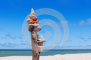 Balance and poise stones. Rock zen on the background of blue sky and sea