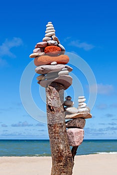 Balance and poise stones. Rock zen on the background of blue sky and sea