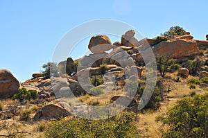 Balance Rock - Desert Terrain Mountain Rocks against a bright Blue Cloudless Sky