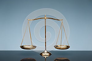 Balance scale on blue background