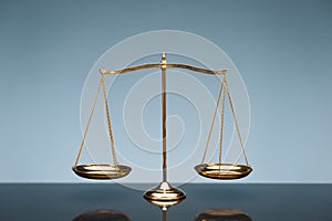 Balance scale on blue background photo
