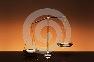 Balance scale on orange color background