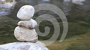 Balance stone by the river.