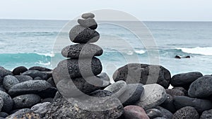 Balance stone tower on sea shore