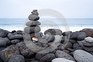 Balance stone tower on sea shore