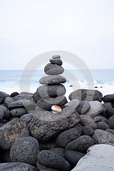 Balance stone tower on sea shore