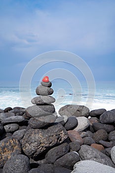 Balance stone tower on sea shore