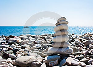 Balance of stones against the background of the sea