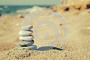 Balance of stones on the beach. Vintage tinting