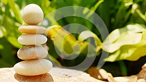 The Balance Stones are stacked as pyramids in a soft natural bokeh background, representing the calm philosophical concept of