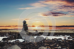 Balance stones, Zen stone stacked, with blurred sunset background