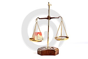 Balance your life concept with scale weighting money and family life isolate on white background