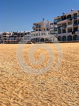 Balanced beachscape a harmonious blend of sand, buildings, and natural beauty