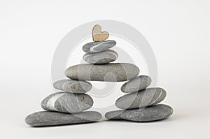 Pyramid of sea pebbles on white background. Life balance and harmony concept